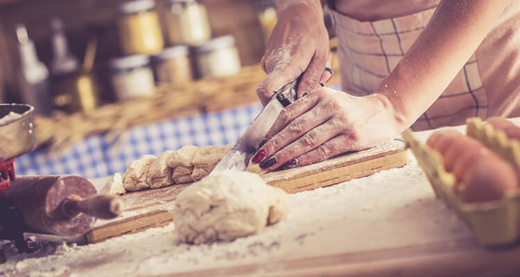 Chef shaping fresh dough